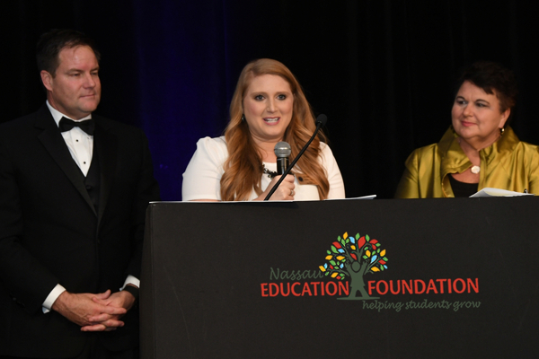 Autumn Nicks accepts the 2017 Teacher of the Year award from the Nassau Education Foundation. Pictured are Autumn Nicks, Aaron bean, and Kathy Burns.