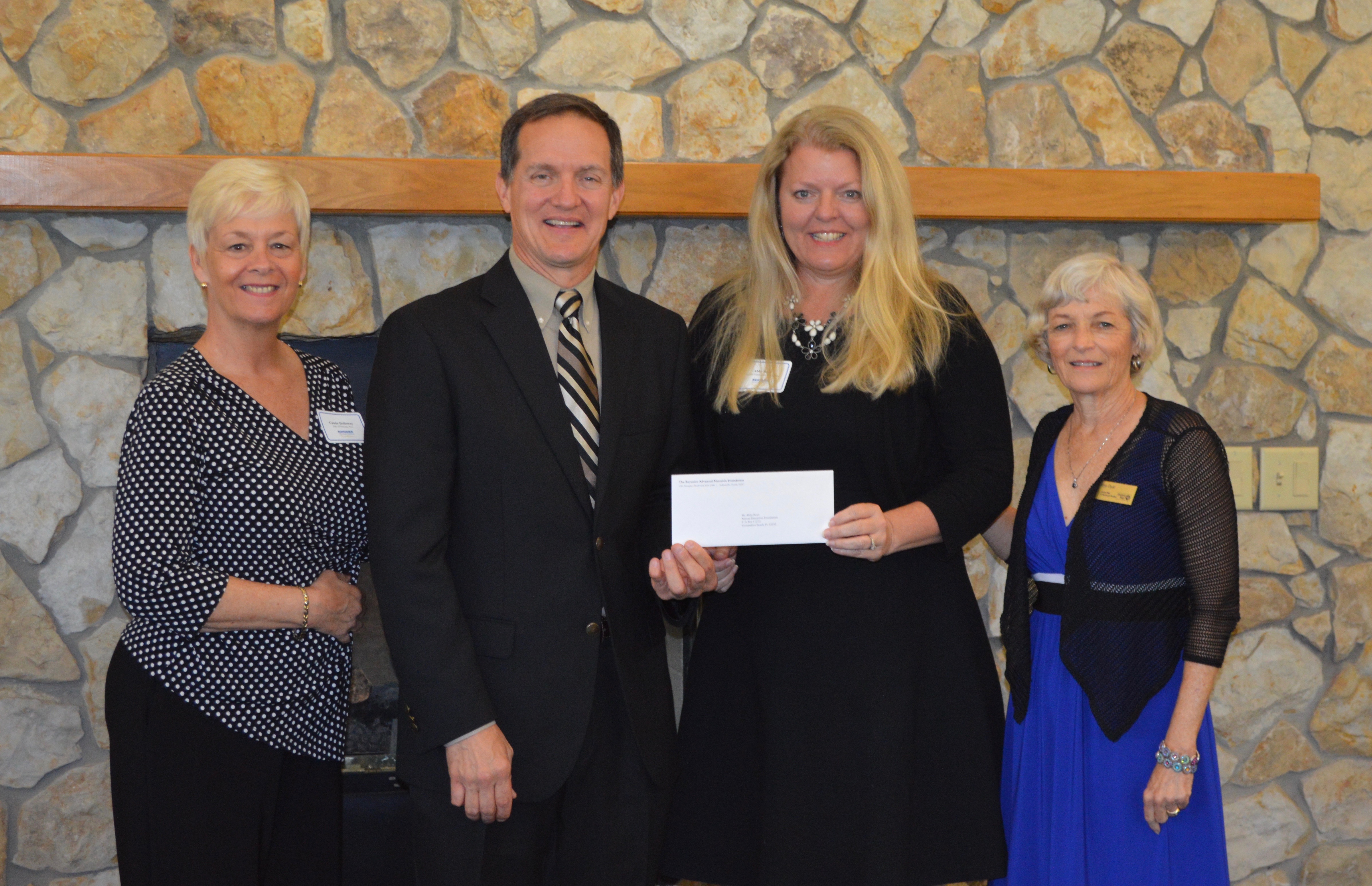 Photo of N.E.F. Board Member Candy Holloway, C.A. McDonald from Rayonier Advanced Materials, N.E.F. Executive Director Abby Bean, and N.E.F. Board Member Amy Dwyer