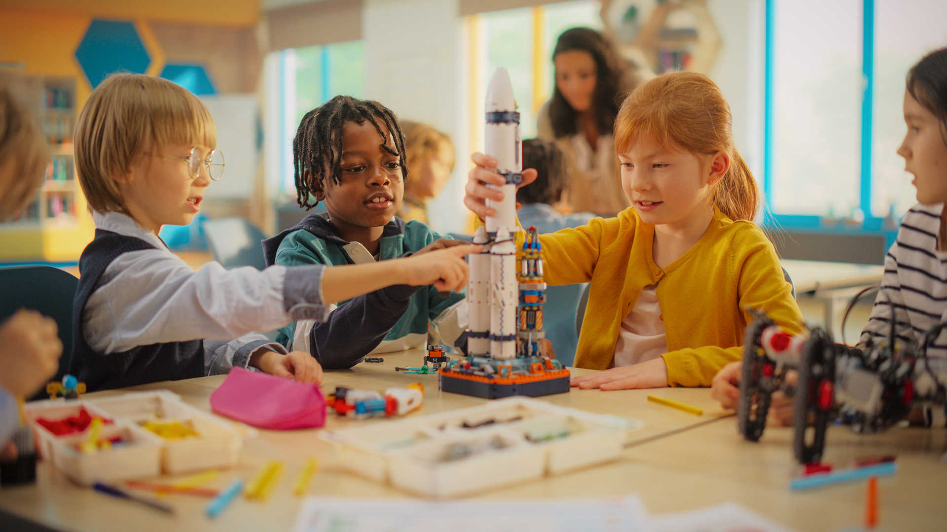Elementary students work together to build and test a model rocket during a hands-on STEM activity.